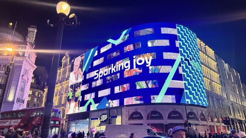 Looking up at the Piccadilly Screen lighting up London in blue with the works 