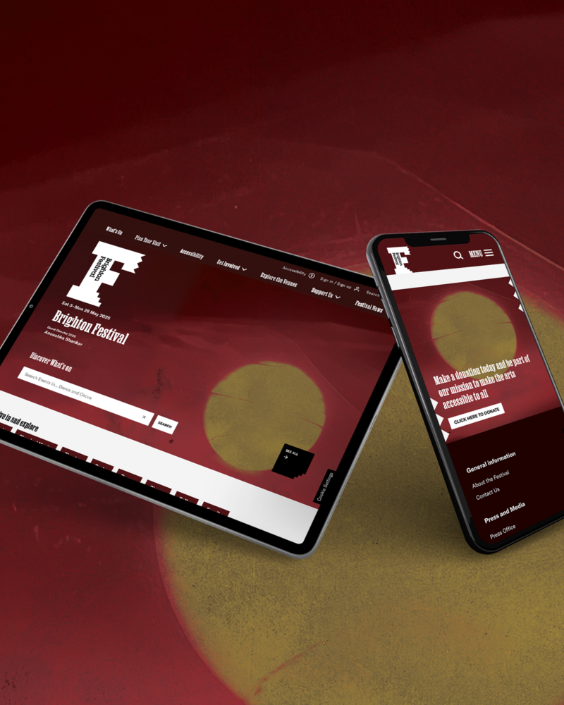 Over a drawn image of a sunset sit a table and phone showing the website