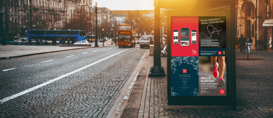 A bus stop advertising space in a british town shows work we have done for SA Law