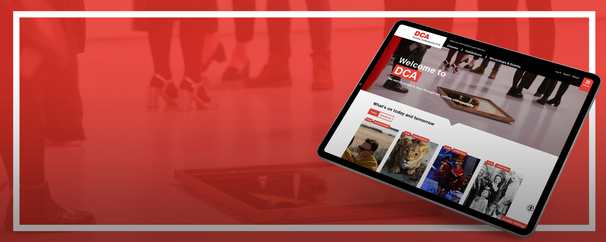 An iPad showing the DCA website homepage
