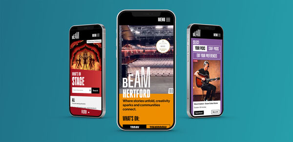 Three phones show the website on a blue background