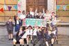 A group of children holding a sign that reads 