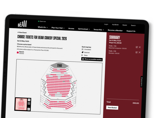 A tablet shows the custom seat map for a large venue within BEAM.