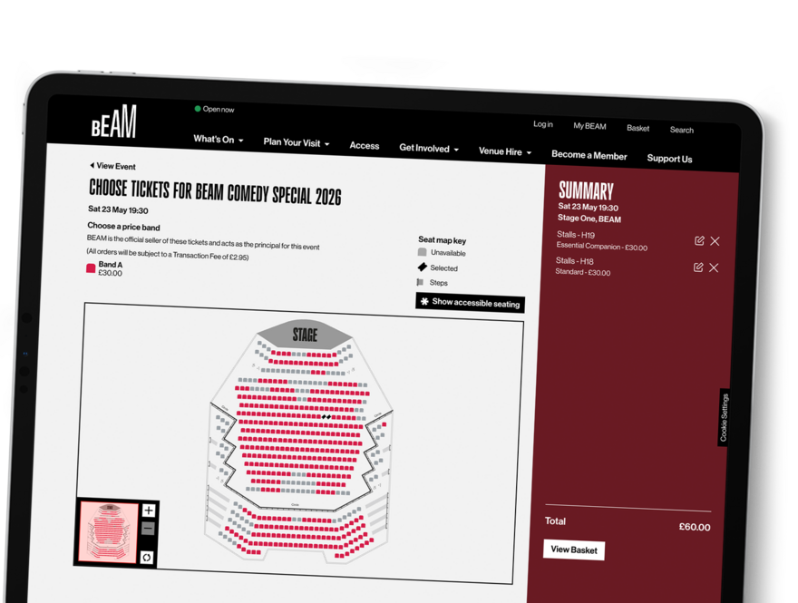 A tablet shows the custom seat map for a large venue within BEAM.