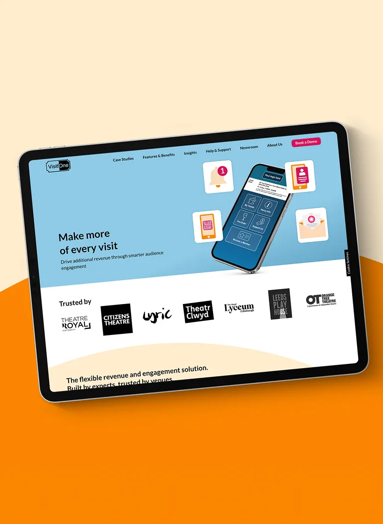 Over an orange background with a curve design, a tablet shows the Visit One website which has a blue background and an image of their app.