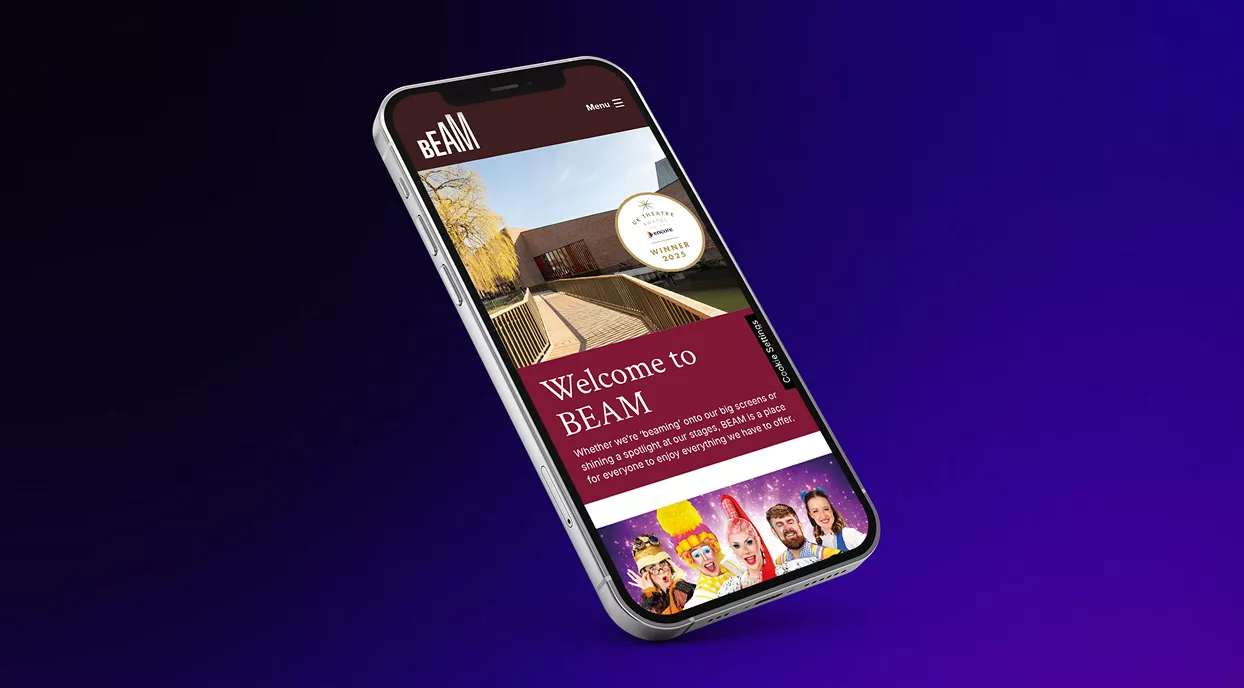 Over a black to purple-blue gradient background, a phone showing the BEAM Hertford website floats.