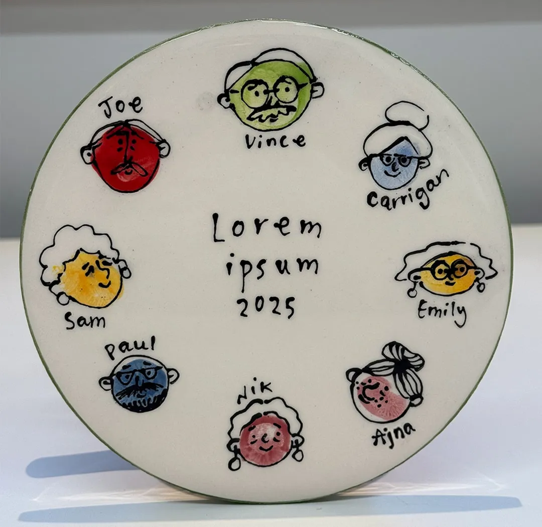 A ceramic plate with colourful thumb prints turned into characters of Grandmas and Grandads, in the centre handwritten text reads lorem ipsum 2025.